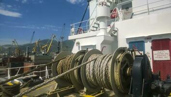 Mechanisms of tension control ropes. Winches. Equipment on the deck of a cargo ship or port photo