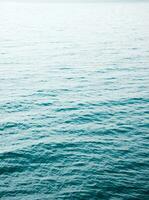 Abstract unfocused sea water background photo