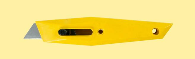 Industrial knife closeup on yellow photo