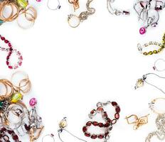 Various jewelry on the white background photo