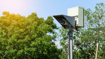 Old surveillance camera install on the metal gray pole photo