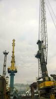 Port cranes against the sky. Cargo industrial port photo