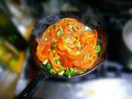 Saute of red bell pepers and jalapenos photo