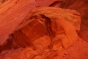 Detail patterns and cracks in Red Navajo sandstone walls photo