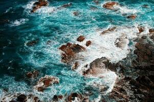 ocean shore with rocks photo