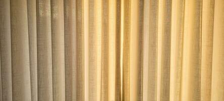 Radiant and welcoming, this sunlit house curtain creates a warm and inviting atmosphere. Purchase this image and illuminate your projects with luminosity and comfort photo