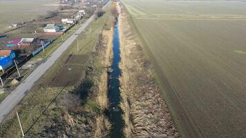 The channel of the lower level of the irrigation system of fields. Infrastructure for the cultivation of rice photo