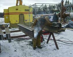 Safety at work. Welding and grinding of iron constructions. Indu photo