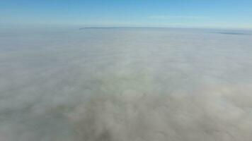 Fog above the ground. Top view of the fog. Low clouds. Morning mist condensation. Shooting with a drone photo