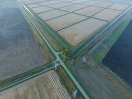 Crossroads paved roads through the fields. View from above photo
