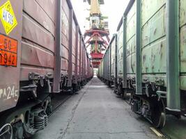 Passage between Freight rail cars. Freight cars in the port. photo