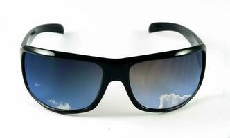 female sunglasses with sky photo