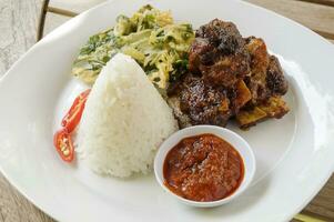 grilled ribs rice with spicy sauce photo