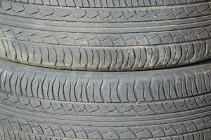 The background of the tread pattern of the car wheel. Rubber tir photo