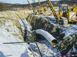 Construction of an oil and gas pipeline. Industrial equipment photo