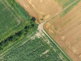 Crossroads paved roads through the fields. View from above photo