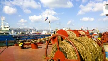 Mechanisms of tension control ropes. Winches. Equipment on the deck of a cargo ship or port photo