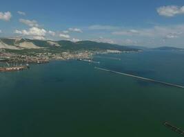Top view of the bay Tsemess. Mol - building to stop the waves. photo