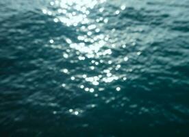 Abstract unfocused sea water background photo