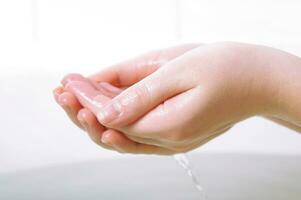 hands in shower photo