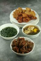 spicy chili chicken liver, and spinach, tempeh and sour vegetables, selective focus photo