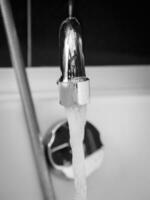 Tap closeup in modern bathroom photo