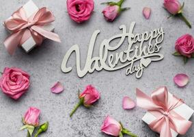 Valentine's Day card. Pink roses and gift boxes photo