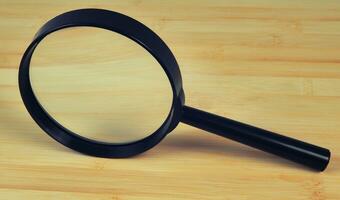 magnifying glass on white photo