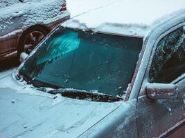 Car windshield closeup in the snow photo