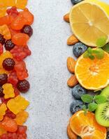 Chewable gummy vitamins and fruits photo