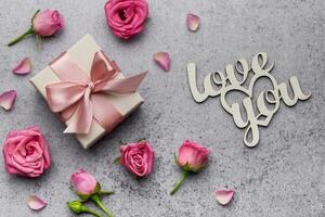 Valentine's Day card. Pink roses and gift boxes photo