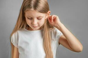 Portrait of cute little girl with long light hair photo