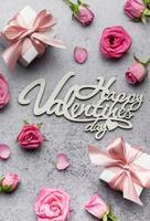 Valentine's Day card. Pink roses and gift boxes photo