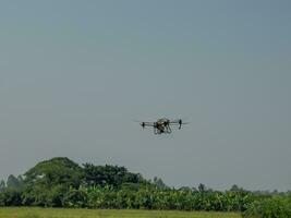 The drone can be controlled by mobile phone using GPS signals to control the direction of agricultural movement. photo