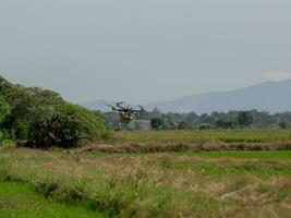 The drone can be controlled by mobile phone using GPS signals to control the direction of agricultural movement. photo
