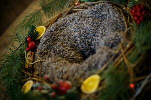 Woolen basket with Christmas decorations on a wooden background. Rustic style. photo