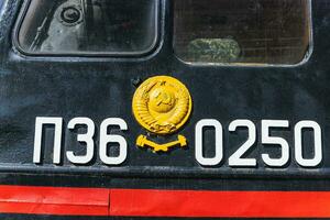 Text and numbers on a metal surface with the symbols of the USSR for design and commercial use photo