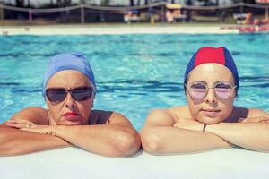 portrait of mother and daughter in swimsuit photo