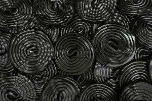 group of spiral wheels of black licorice isolated on white photo