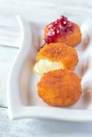 Camembert nuggets with cranberry sauce photo