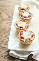 Mince pies with Christmas tree branch photo