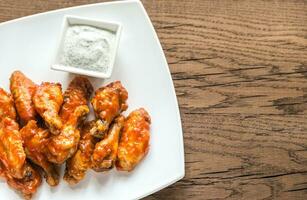 Portion of buffalo chicken wings photo