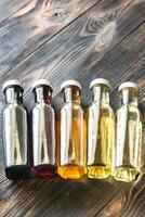 Bottles with different kinds of vinegar photo