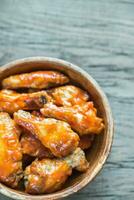 Bowl of buffalo chicken wings photo