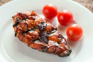 Grilled chicken steak with cherry tomatoes photo