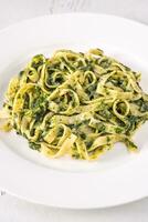 Creamy spinach pasta photo