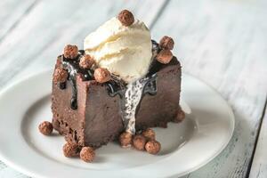 Chocolate brownie with vanilla ice cream photo