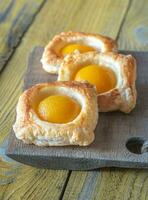 Puff pastry with canned peaches photo