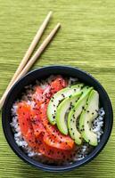 White rice with salmon and avocado photo