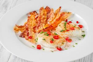 Poached eggs with bacon photo